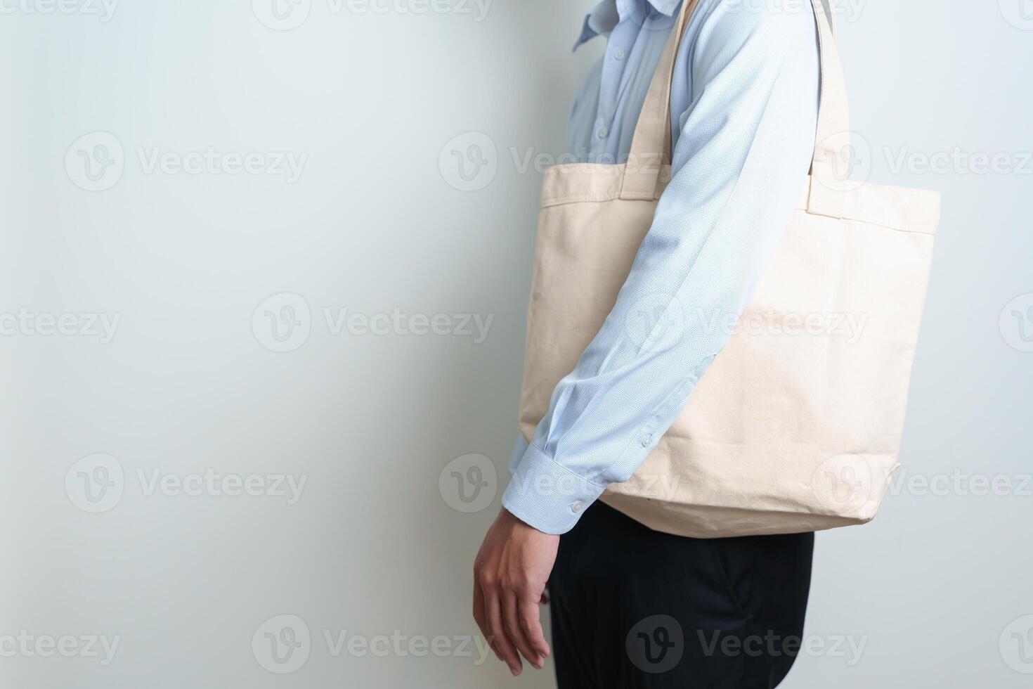 man with Eco Shopping tote bag with Copy space for text. Environmental Protection, Zero waste, Reusable, Say No Plastic, Sustainability, Eco Friendly, World Environment day and Earth day concept photo