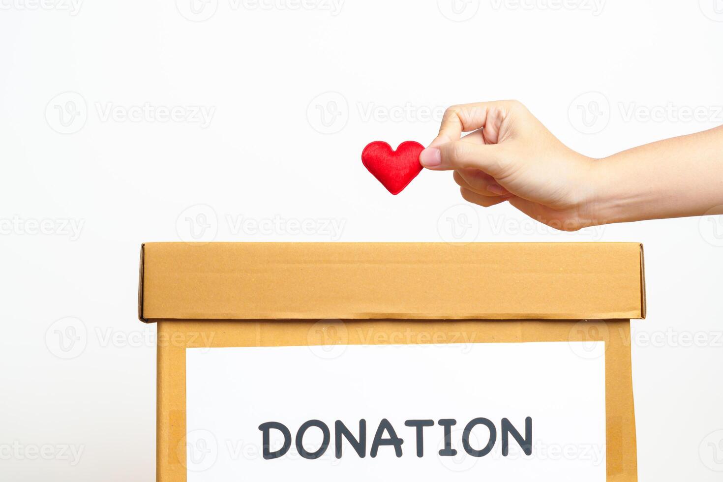 Organ Donation, Charity, Volunteer, Giving and blood Concept. Hand holding red heart into donate box for support poor, homeless, CSR social responsibility, world heart and mental health day photo