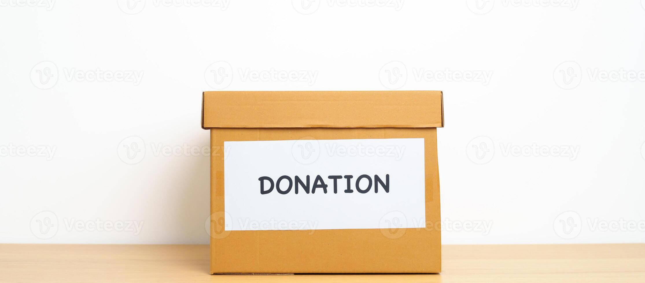 Donation, Charity, Volunteer, Giving and Delivery Concept. People donate Clothes and Food into Donation box at home or office for support and help poor, refugee and homeless people. Copy space photo