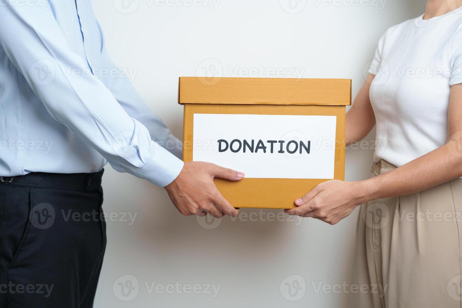 Donation, Charity, Volunteer, Giving and Delivery Concept. People donate Clothes and Food into Donation box at home or office for support and help poor, refugee and homeless people. Copy space photo
