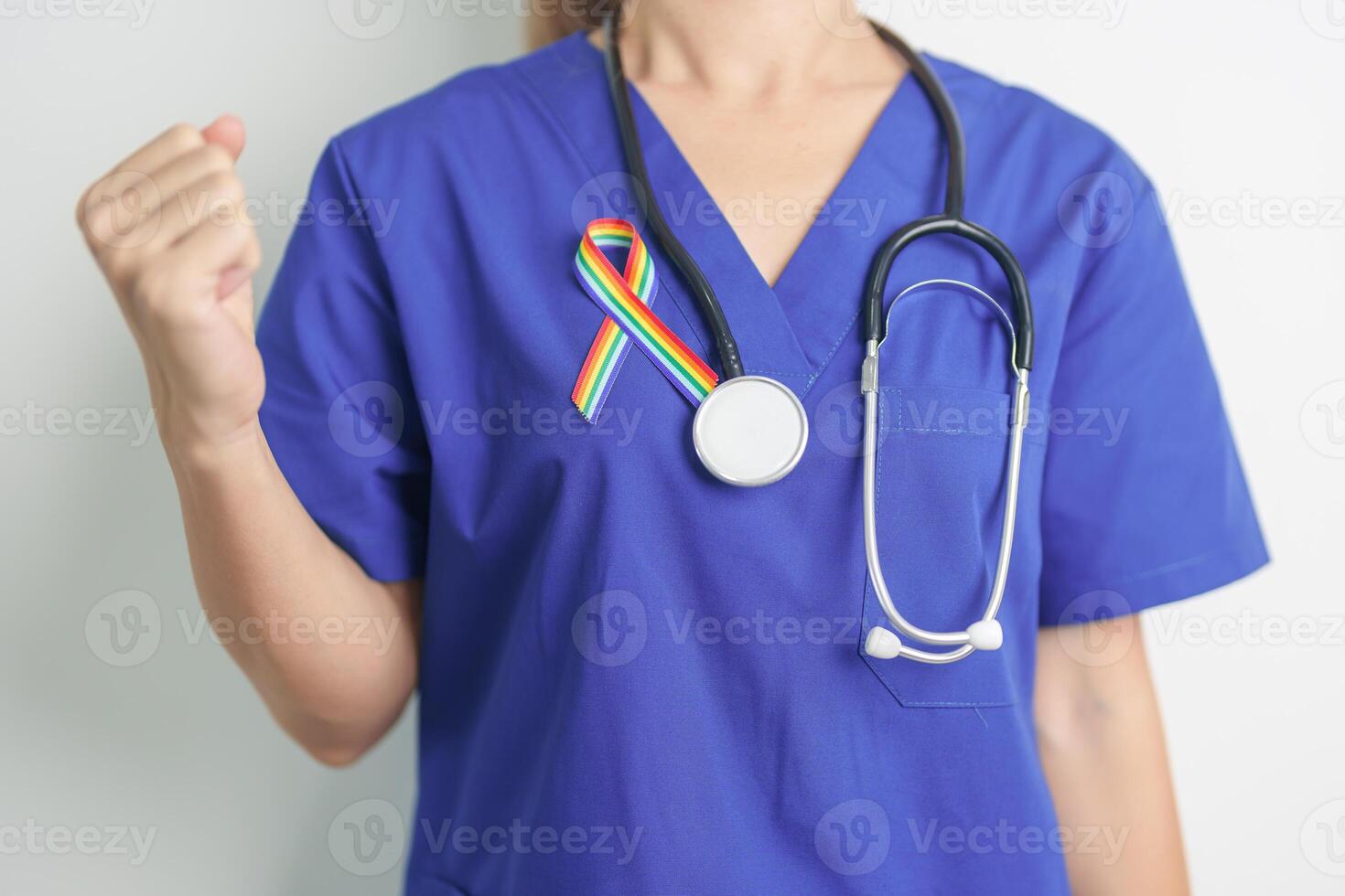 Doctor with LGBTQ Rainbow ribbon for Support Lesbian, Gay, Bisexual, Transgender and Queer community and happy Pride month concept photo