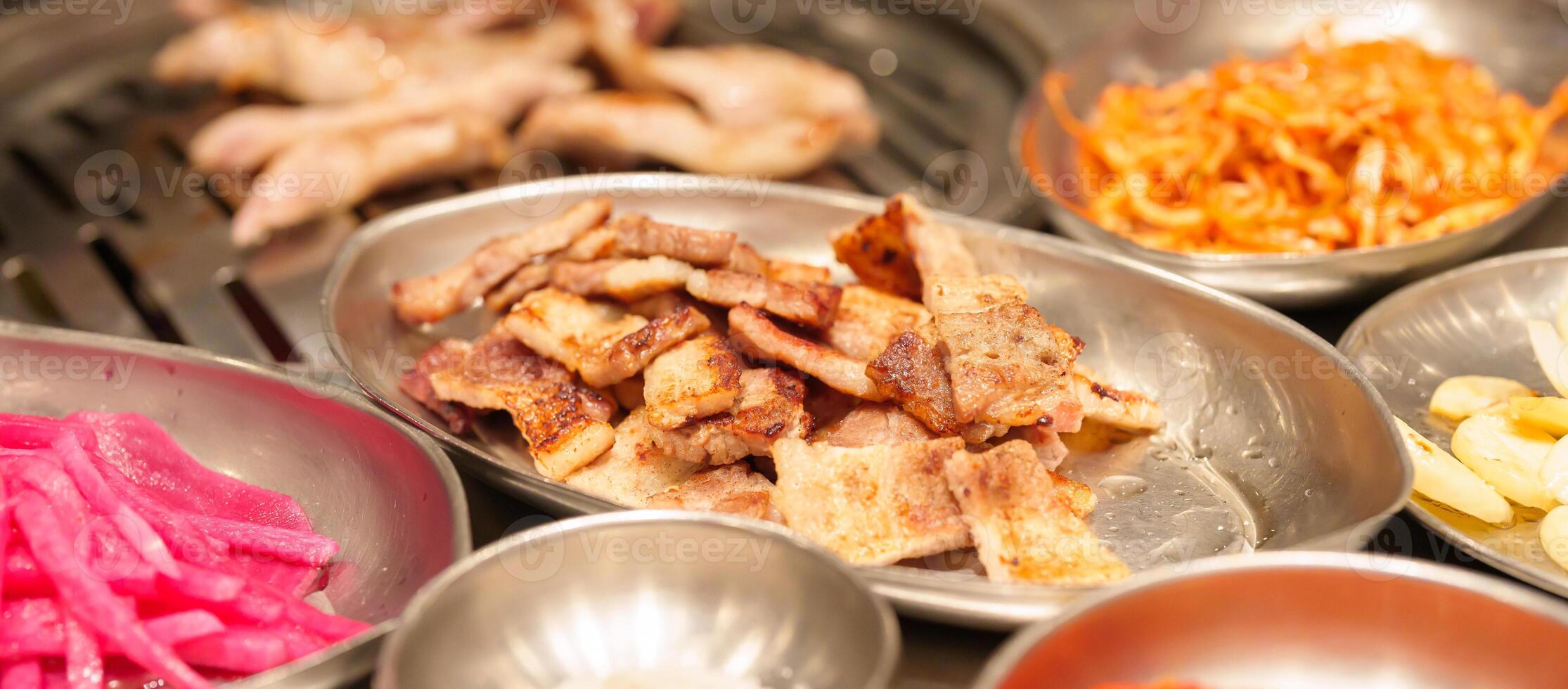 meat pork grilled on stove serve in restaurant. Korean food and BBQ traditional style photo