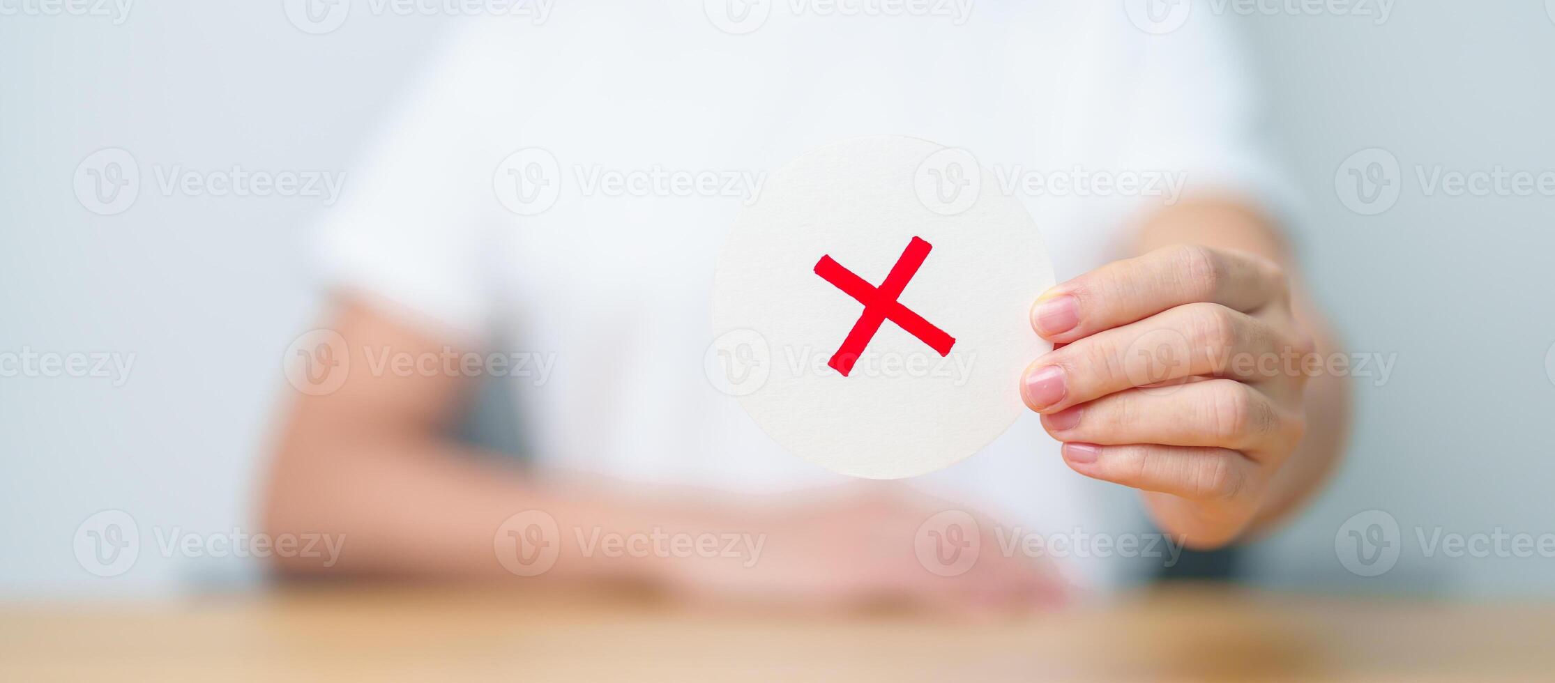 Woman show Wrong symbol paper. True and false, accept and rejected, evaluation, Vote, Poll, Yes or No and Survey concepts photo