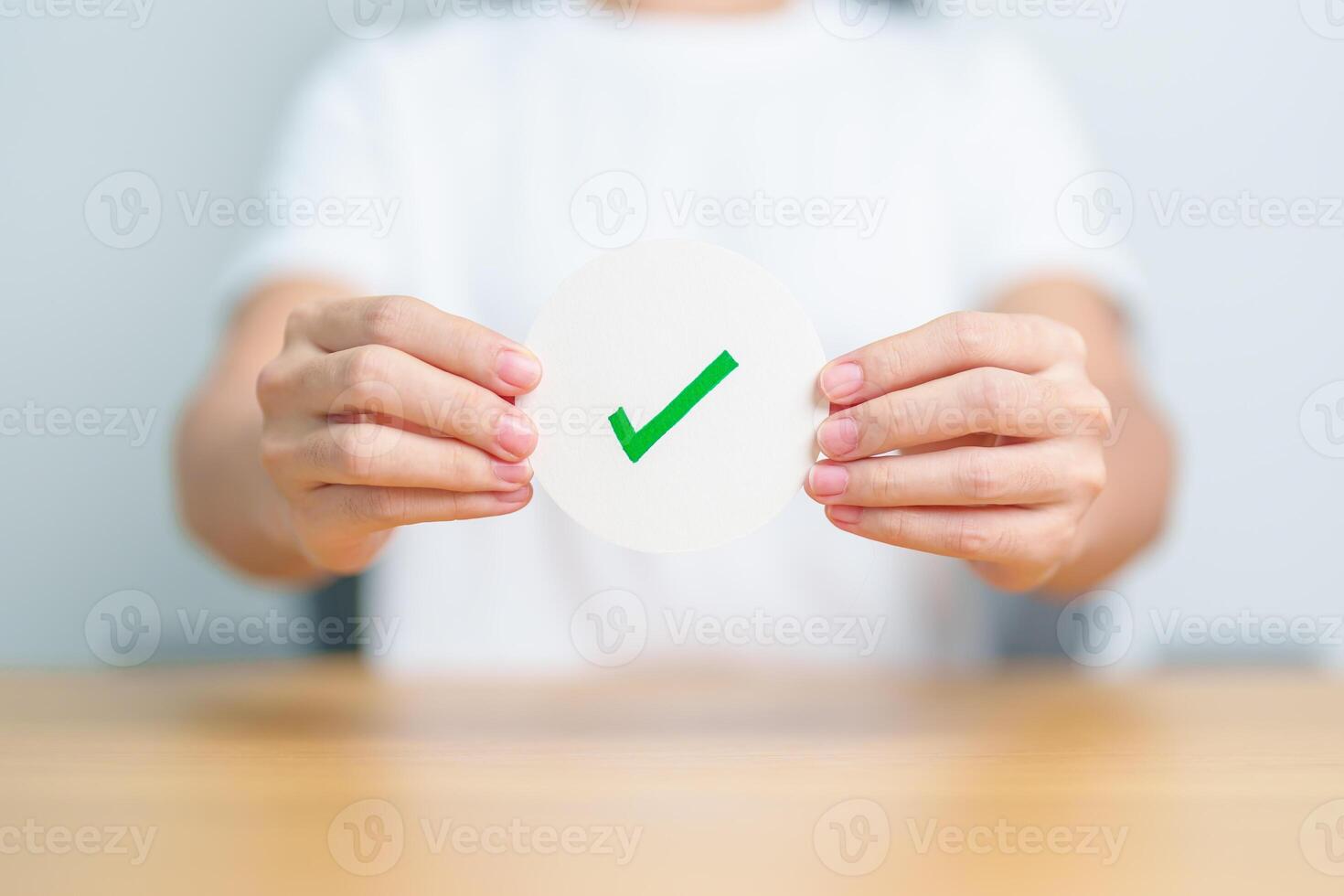 Woman show Right symbol paper. True and false, accept and rejected, evaluation, Vote, Poll, Yes or No and Survey concepts photo