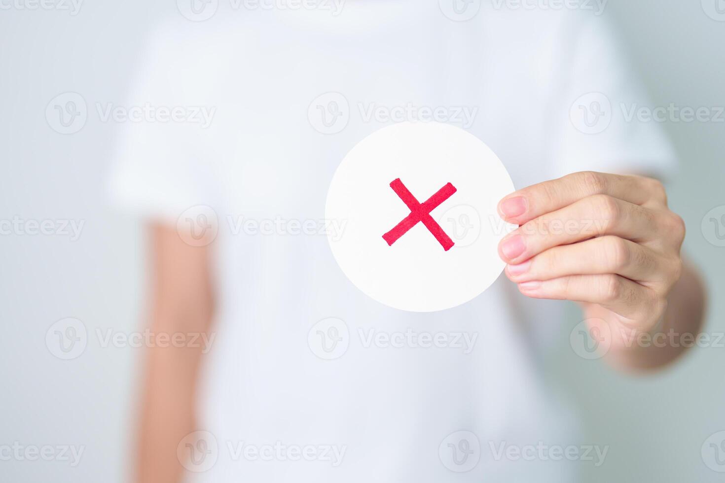 Woman show Wrong symbol paper. True and false, accept and rejected, evaluation, Vote, Poll, Yes or No and Survey concepts photo