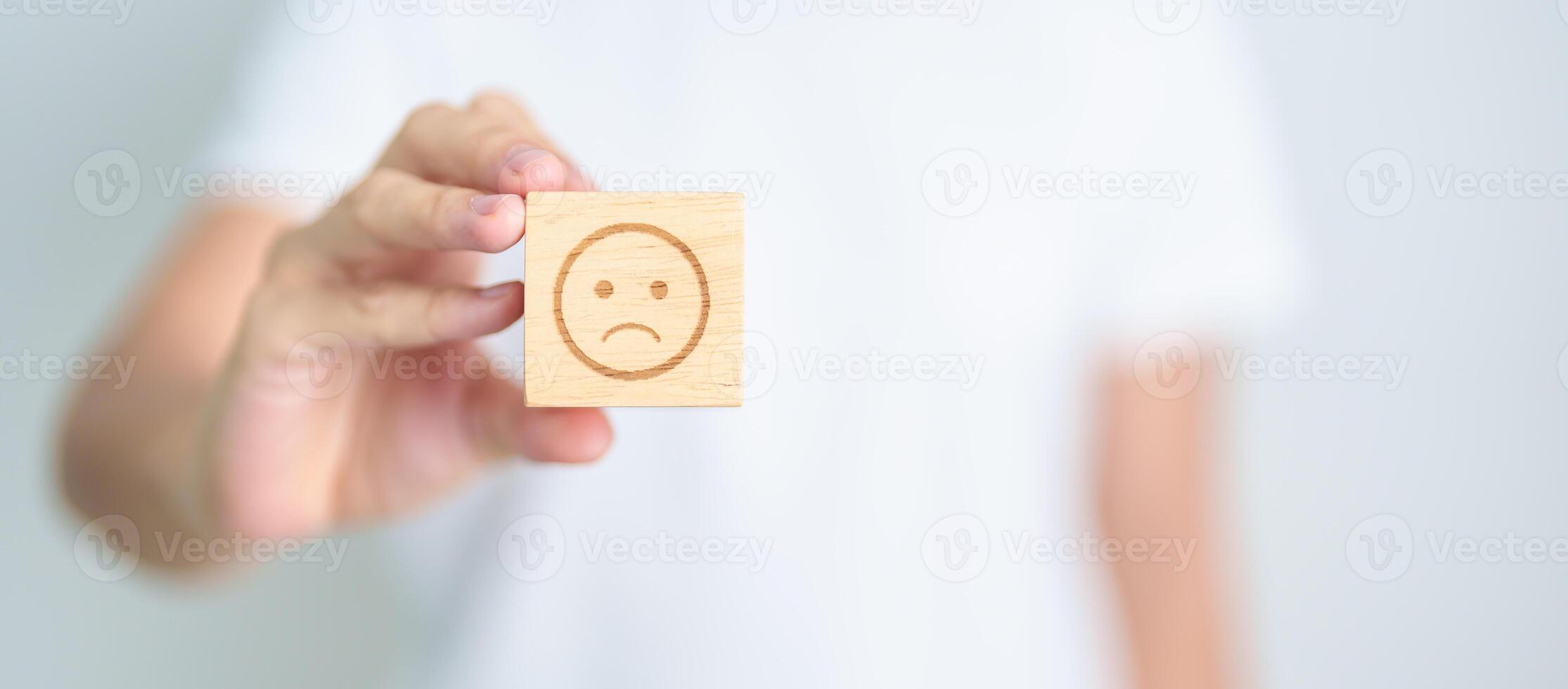Woman show Unhappy Sad face block, Mental health Assessment, Psychology, Health Wellness, Feedback, Customer Review, Experience, Satisfaction Survey, Negative Thinking and World Mental Health day photo
