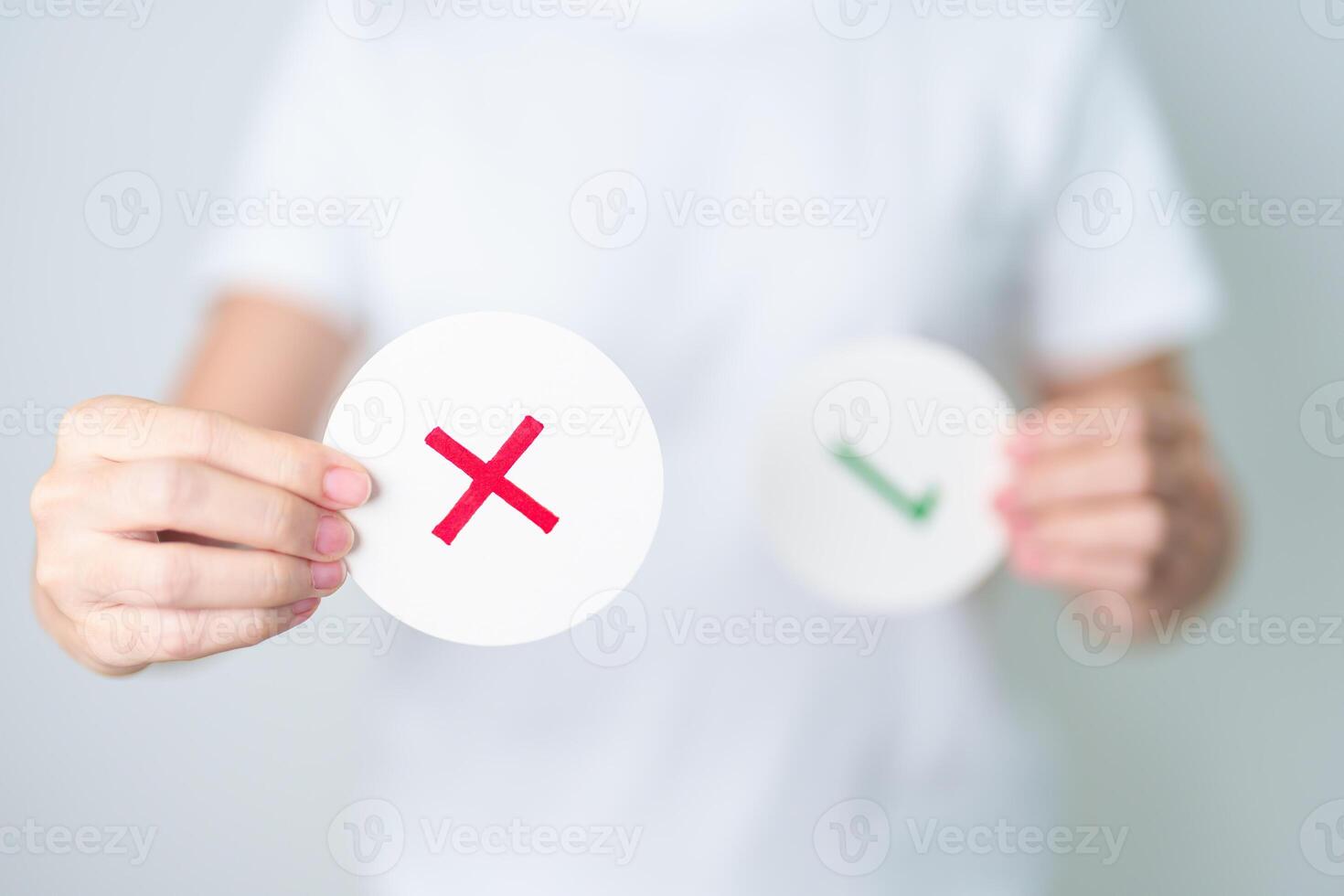 Woman show Wrong symbol paper. True and false, accept and rejected, evaluation, Vote, Poll, Yes or No and Survey concepts photo