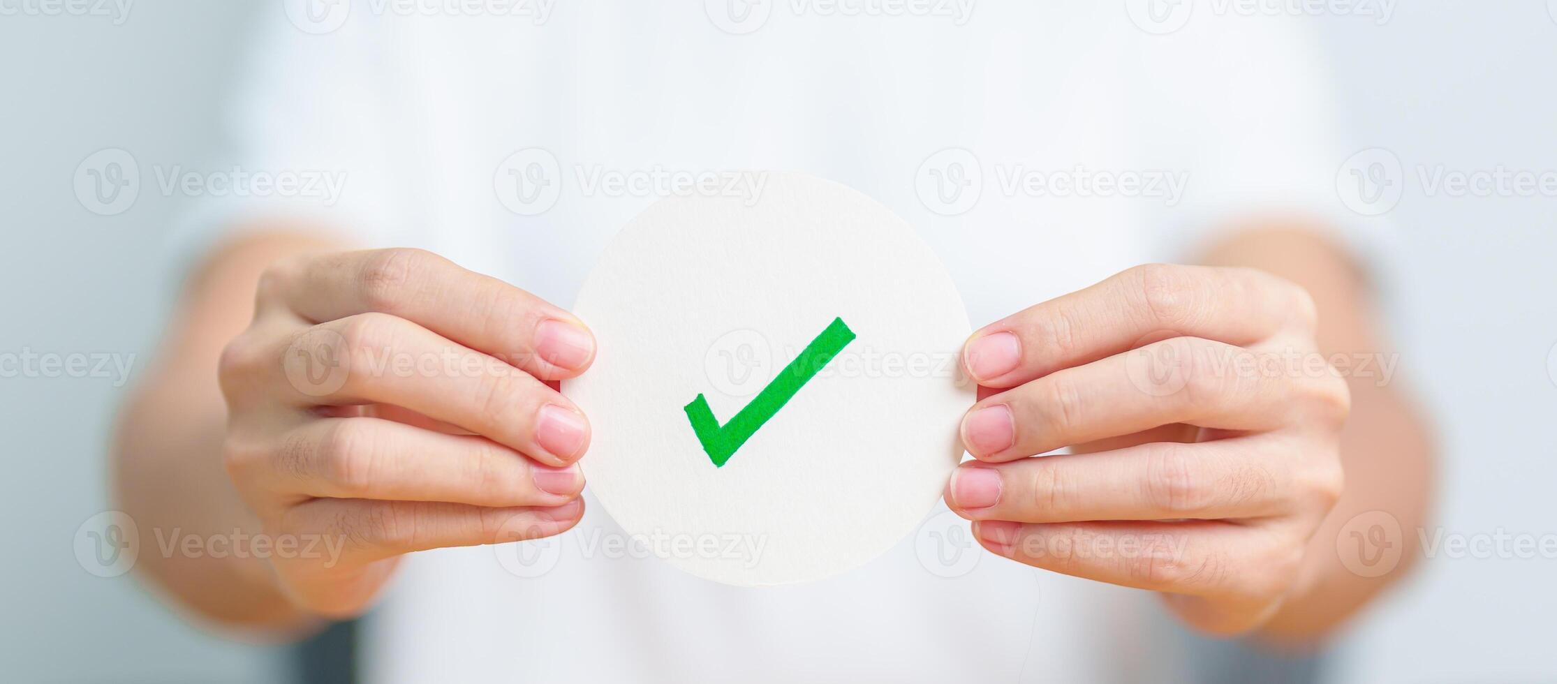 Woman show Right symbol paper. True and false, accept and rejected, evaluation, Vote, Poll, Yes or No and Survey concepts photo