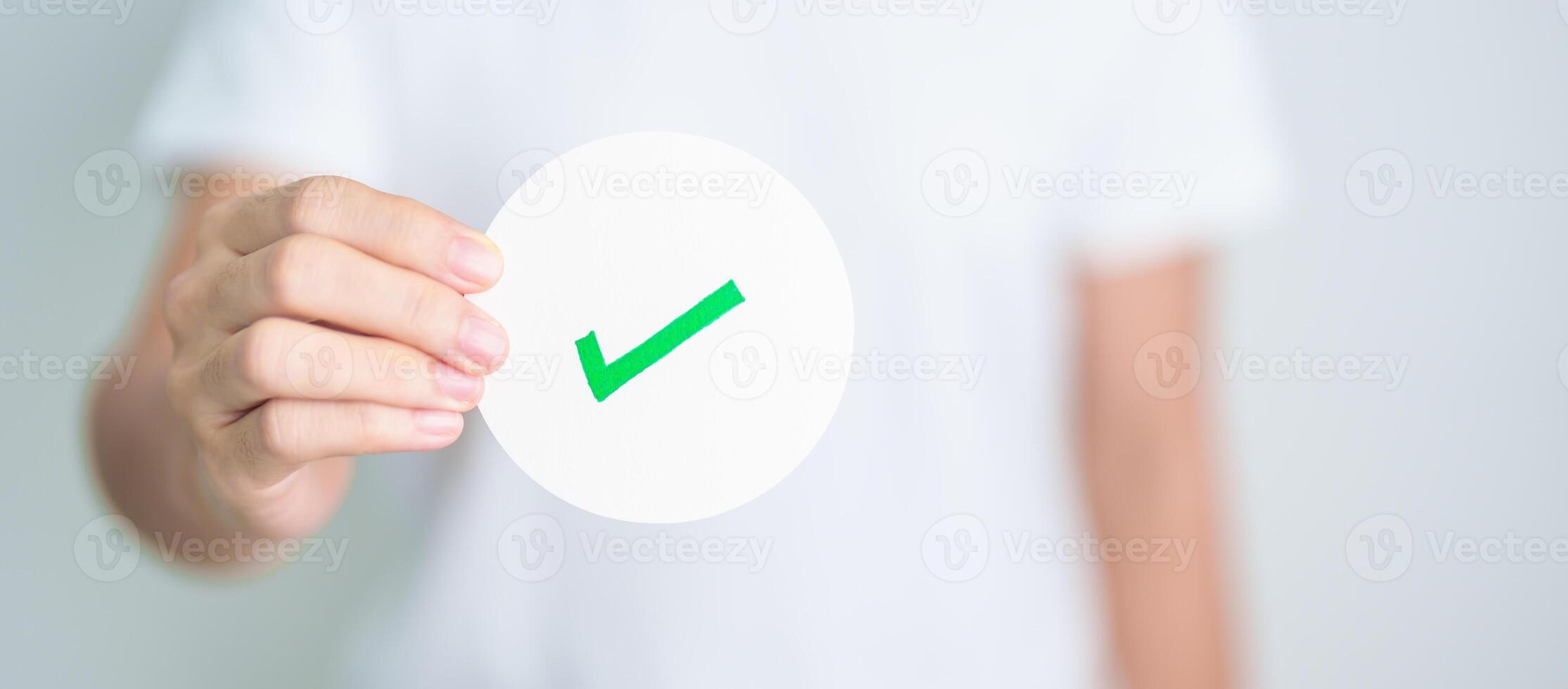 Woman show Right symbol paper. True and false, accept and rejected, evaluation, Vote, Poll, Yes or No and Survey concepts photo