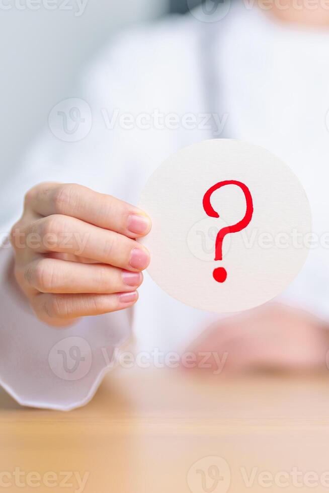 Doctor show Questions Mark on paper. FAQ, frequency asked questions, Answer, Information, Communication, Health, Diagnosis and Medical concept photo