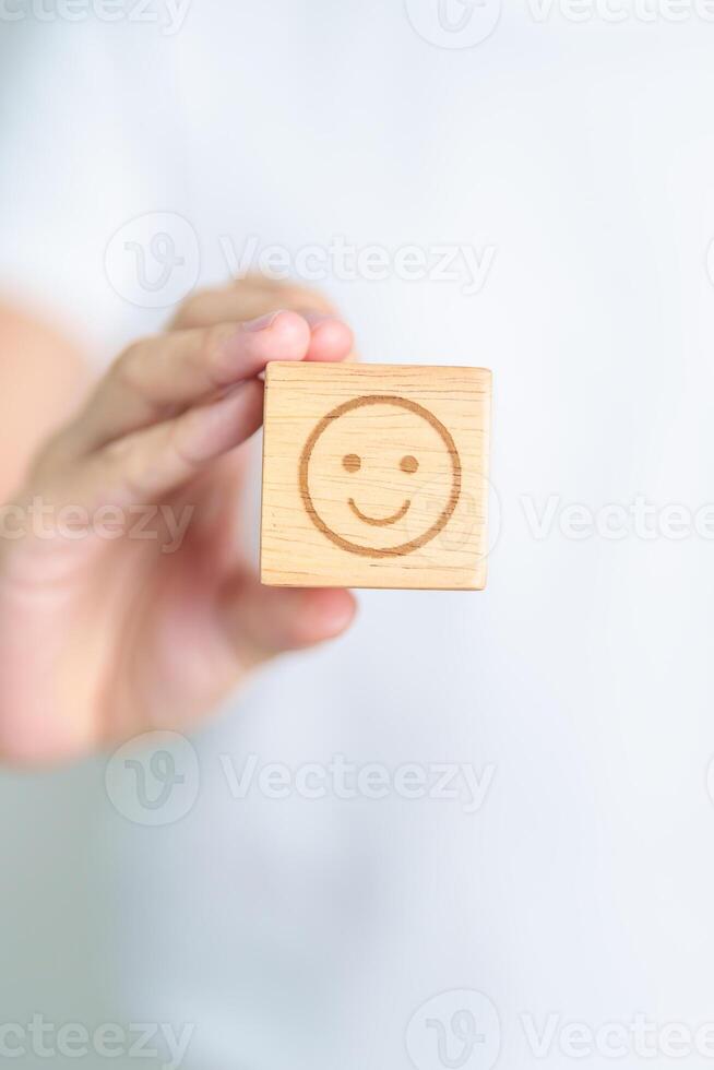 Woman show Happy Smile face block, Mental health Assessment, Psychology, Health Wellness, Feedback, Customer Review, Experience, Satisfaction Survey, Positive Thinking and World Mental Health day photo