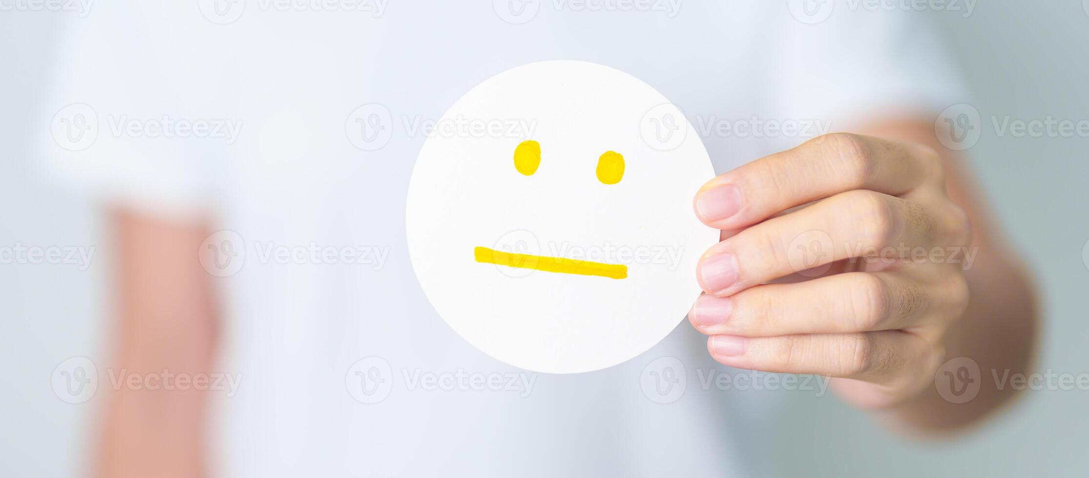 Woman show Emotion face paper, Mental health Assessment, Psychology, Health Wellness, Feedback, Customer Review, Experience, Satisfaction Survey, Positive Thinking and World Mental Health day photo