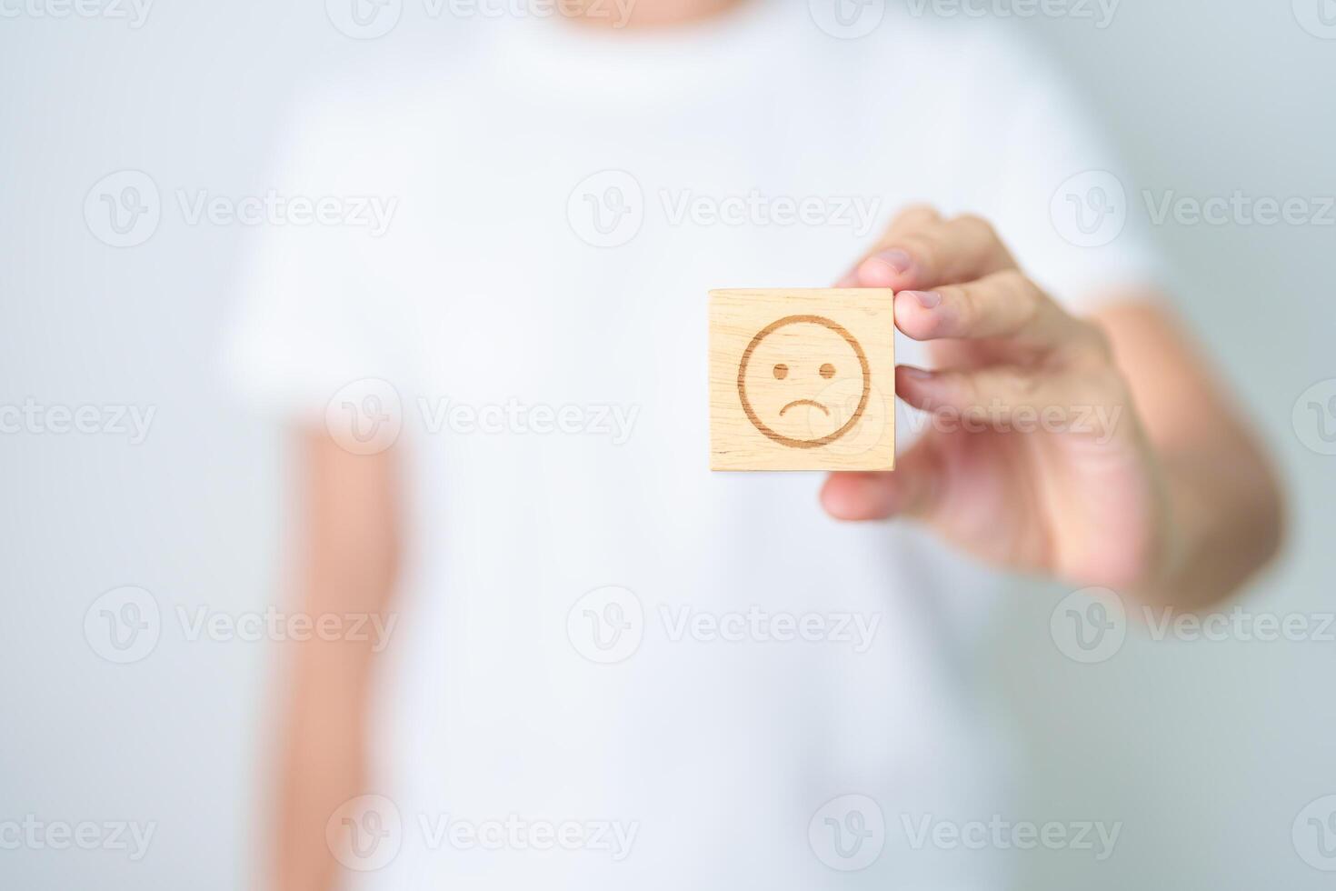 Woman show Unhappy Sad face block, Mental health Assessment, Psychology, Health Wellness, Feedback, Customer Review, Experience, Satisfaction Survey, Negative Thinking and World Mental Health day photo