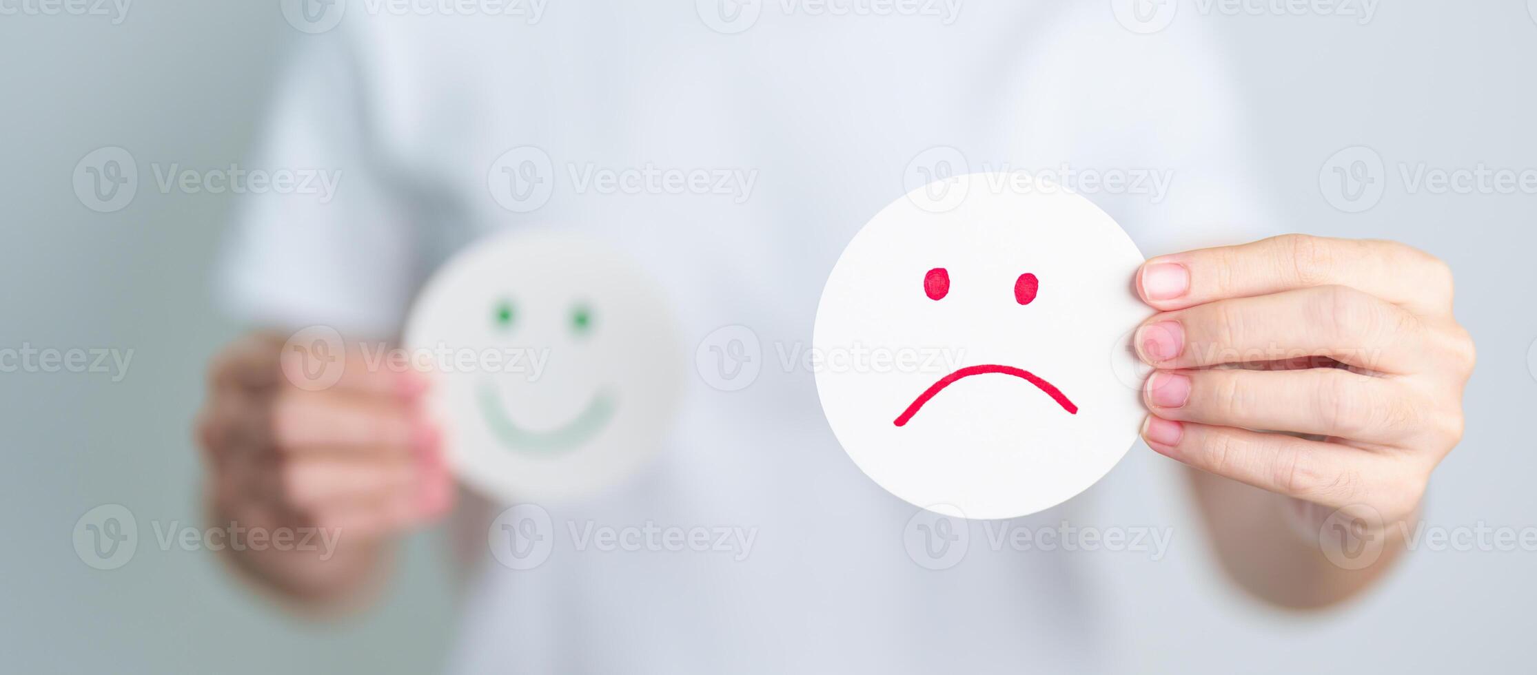 Woman show Unhappy Sad face paper, Mental health Assessment, Psychology, Health Wellness, Feedback, Customer Review, Experience, Satisfaction Survey, Negative Thinking and World Mental Health day photo