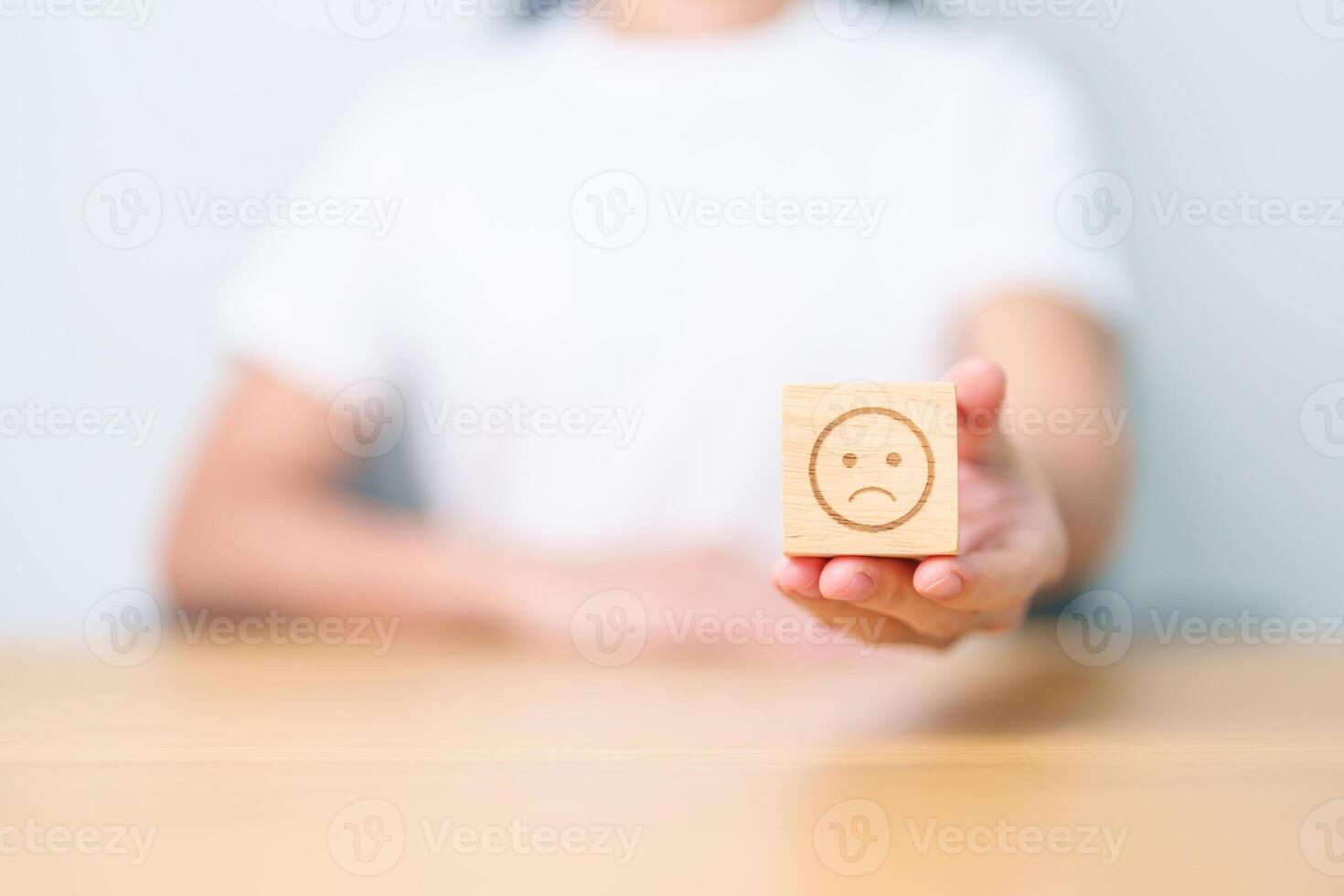 Woman show Unhappy Sad face block, Mental health Assessment, Psychology, Health Wellness, Feedback, Customer Review, Experience, Satisfaction Survey, Negative Thinking and World Mental Health day photo