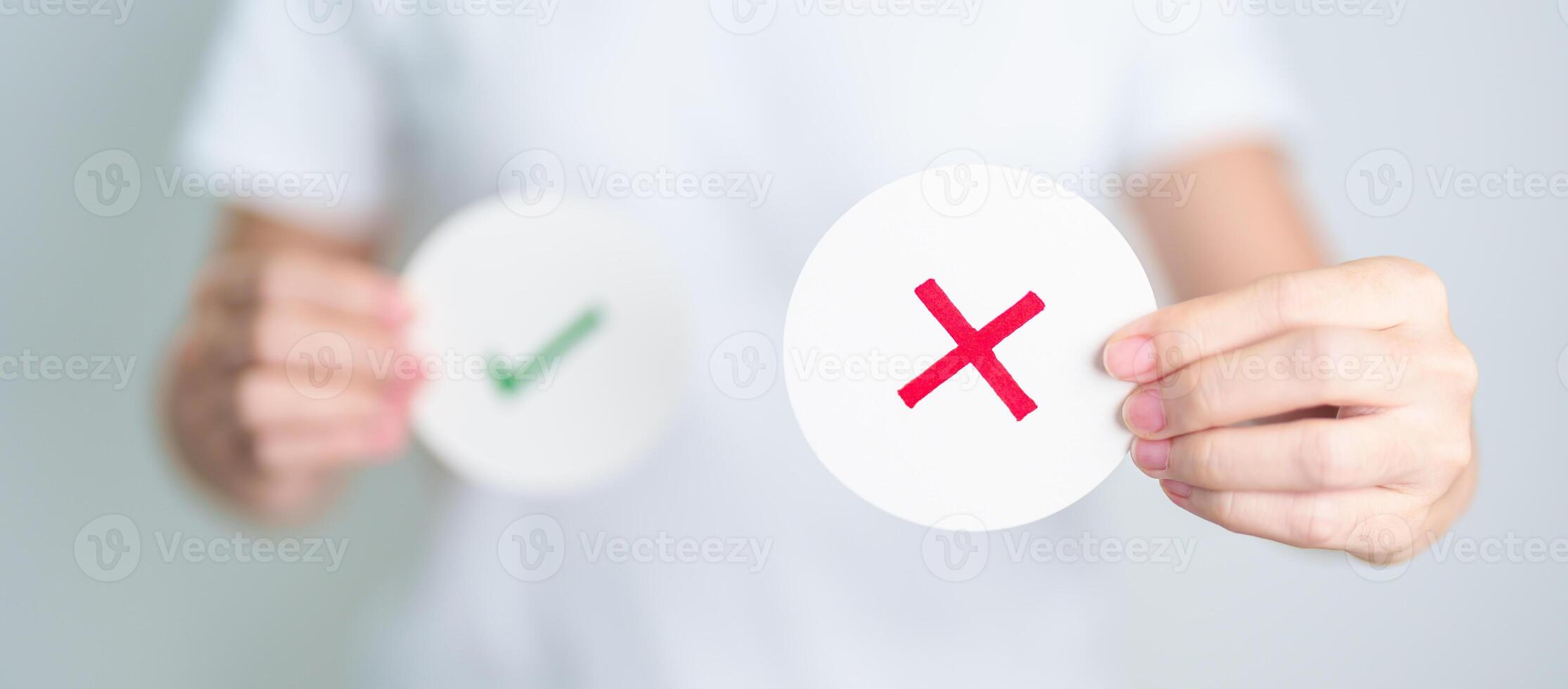 Woman show Wrong symbol paper. True and false, accept and rejected, evaluation, Vote, Poll, Yes or No and Survey concepts photo