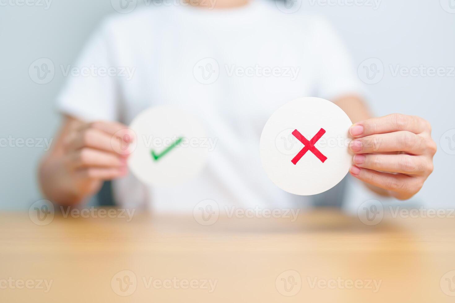 Woman show Wrong symbol paper. True and false, accept and rejected, evaluation, Vote, Poll, Yes or No and Survey concepts photo
