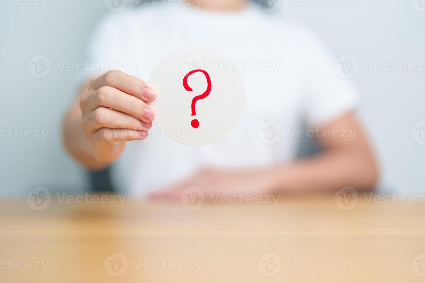 Woman show Questions Mark on paper. FAQ, frequency asked questions, Answer, Q and A, Information, Communication and interrogation Concepts photo