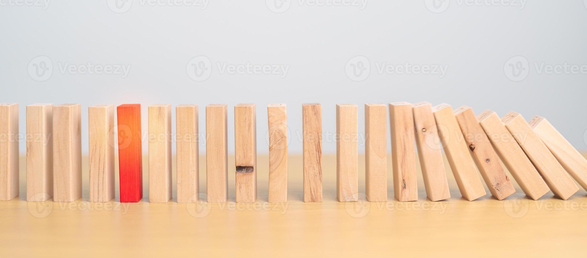 wood domino blocks falling on table. Crisis, fall Business, Risk management, Economic recession, Strategy and solutions concept photo