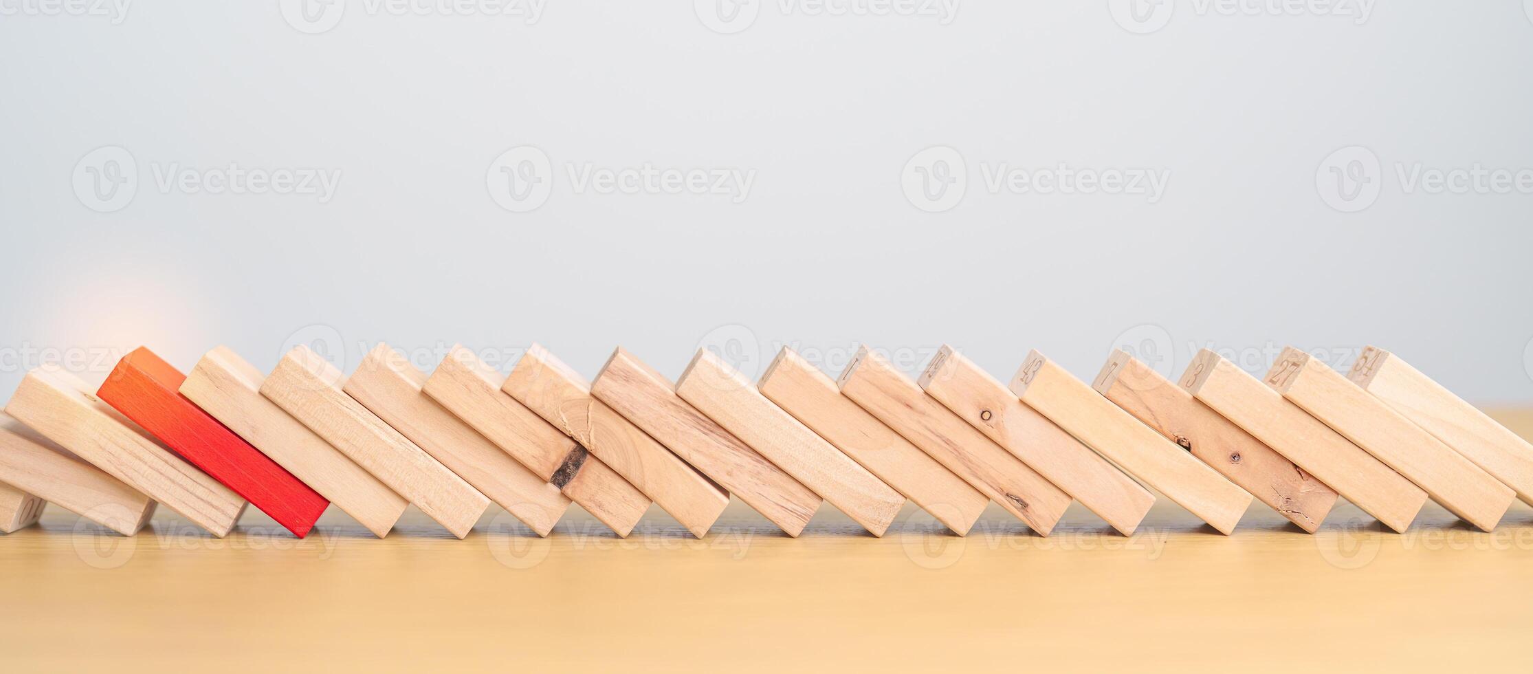 wood domino blocks falling on table. Crisis, fall Business, Risk management, Economic recession, Strategy and solutions concept photo