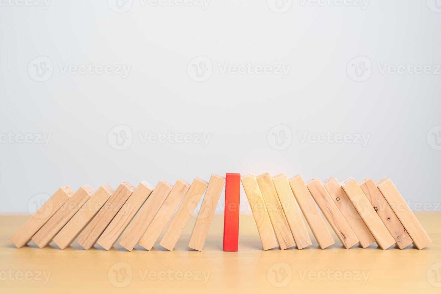 wood domino blocks falling on table. Crisis, fall Business, Risk management, Economic recession, Strategy and solutions concept photo