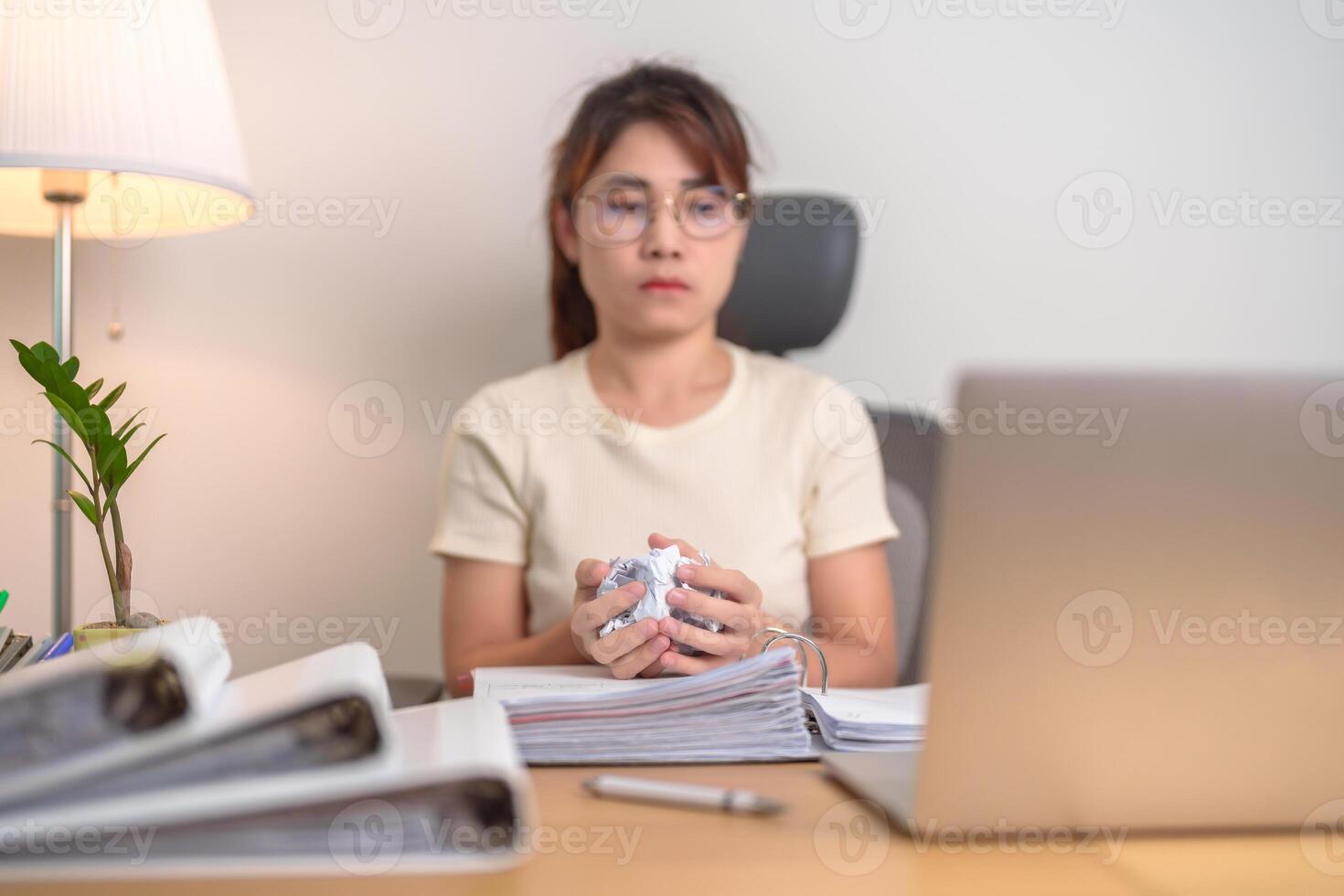 stressed Asian Woman using laptop with mistake paper, Tired female businesswoman working overload at office, Exhausted casual woman with computer at late night in home. Failure, Problem and business photo