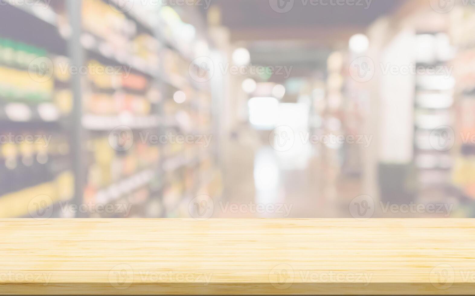 Empty wood table top with supermarket blurred background for product display photo