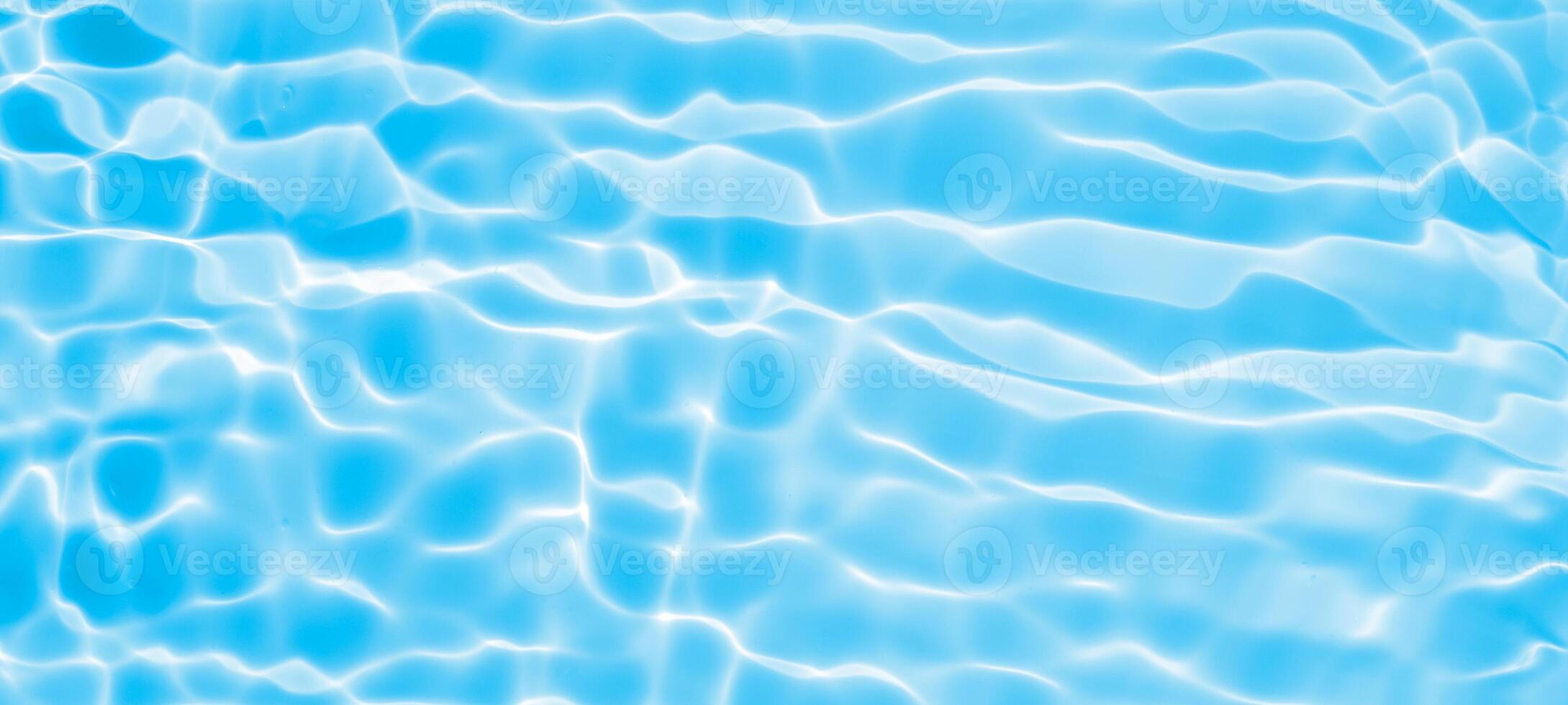 Abstract transparent water shadow surface texture natural ripple on blue background photo