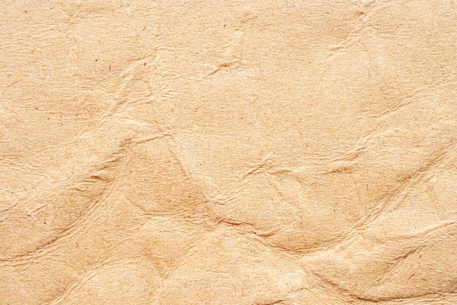 Abstract crumpled and creased recycle brown paper texture background photo