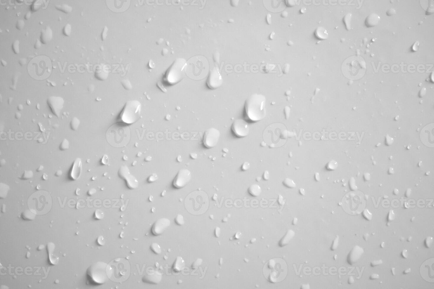 Water drops on white wall background texture photo