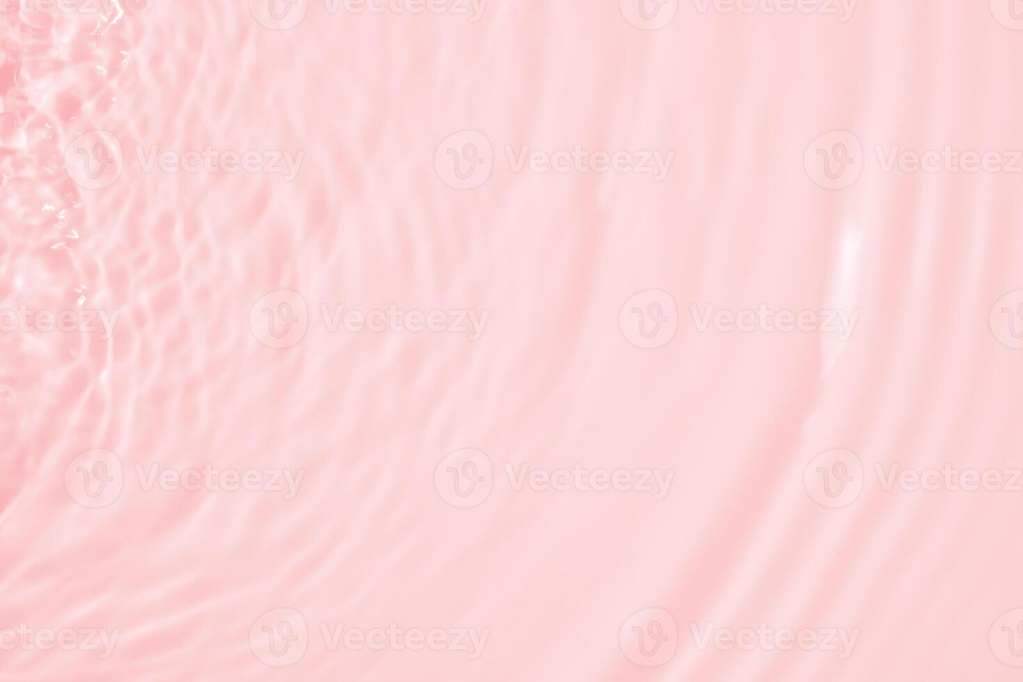 Abstract transparent water shadow surface texture natural ripple on pink background photo
