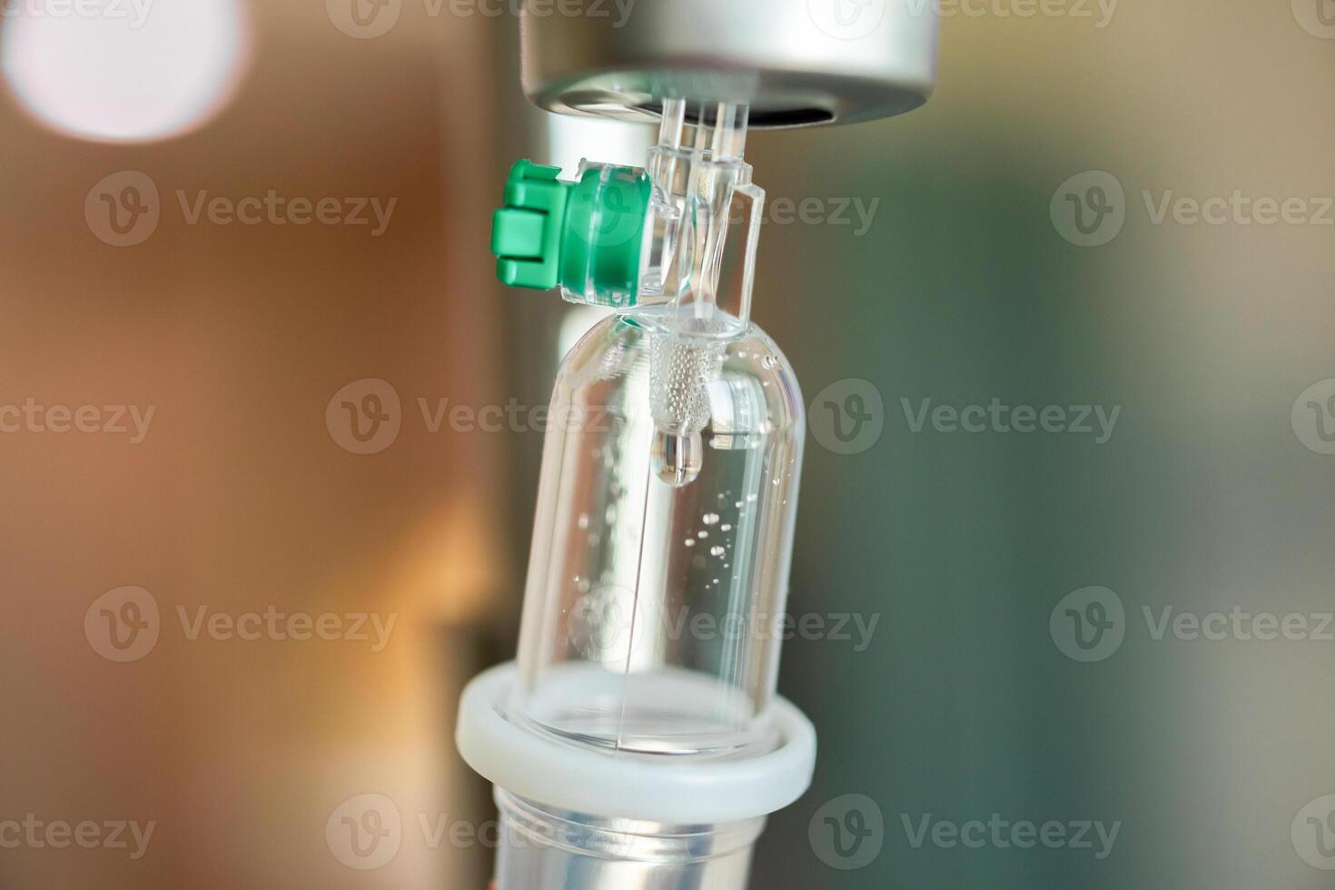 Close up medical intravenous IV drip in hospital background photo