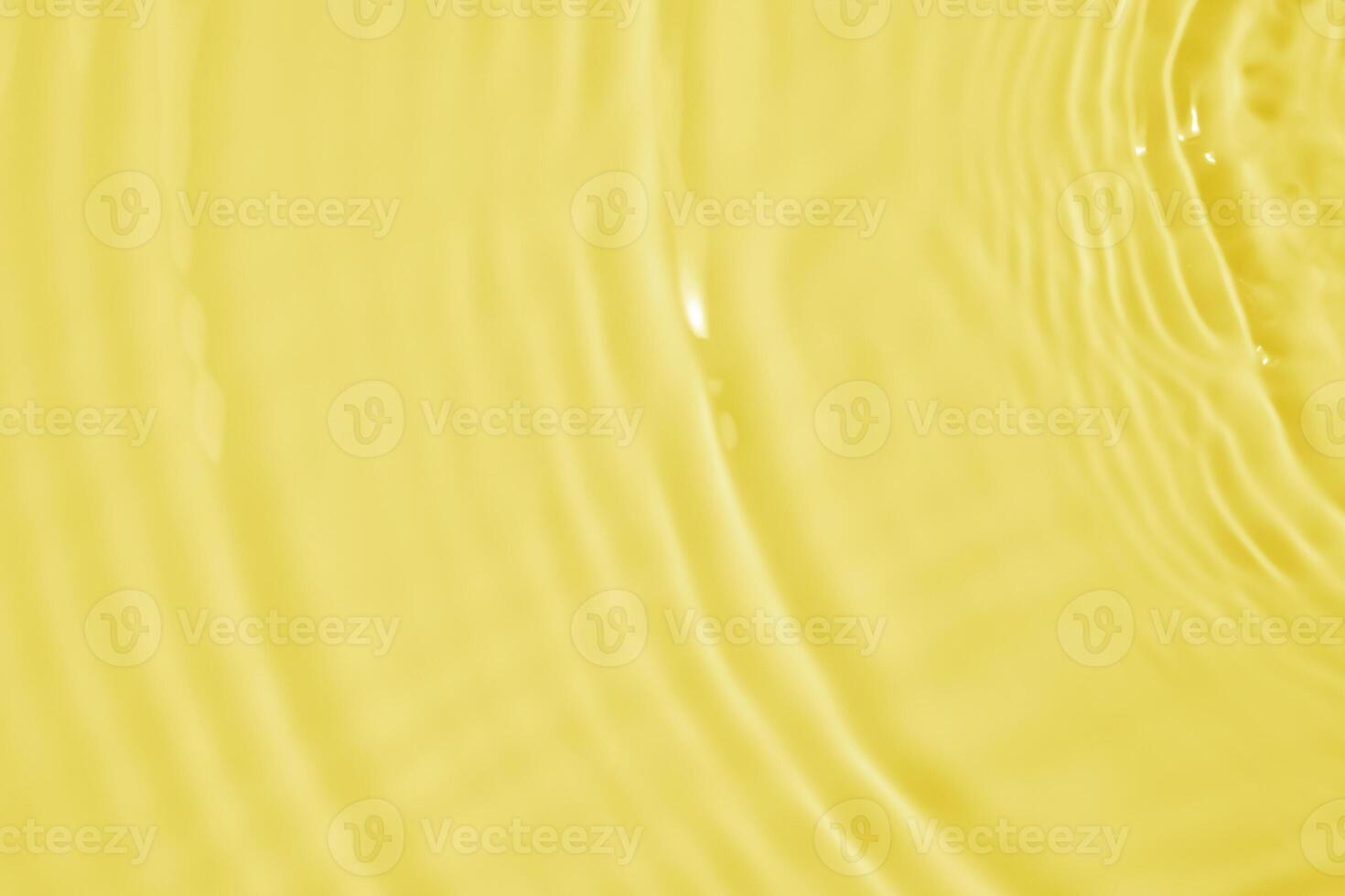 Abstract transparent water shadow surface texture natural ripple on yellow background photo