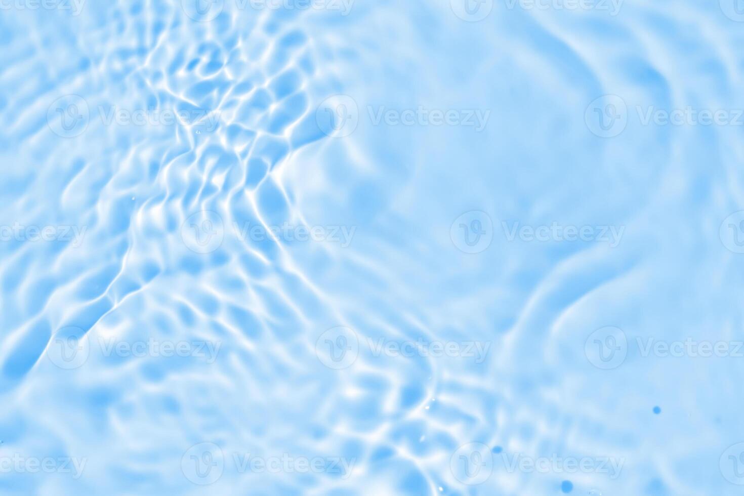 Abstract transparent water shadow surface texture natural ripple on blue background photo