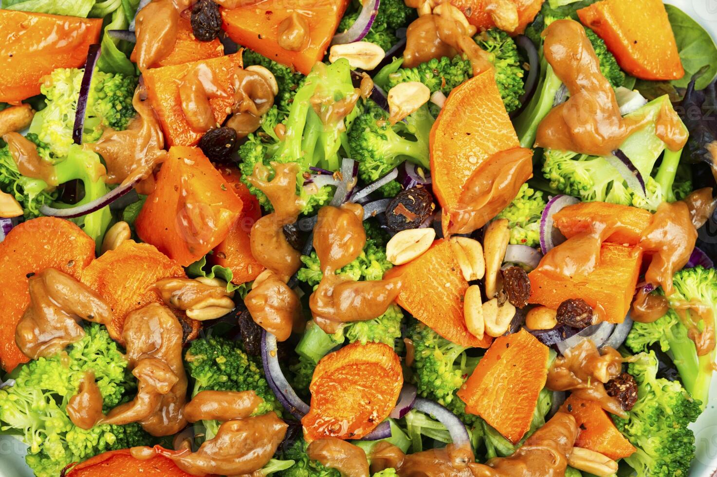 Healthy homemade broccoli salad with roasted sweet potato. photo