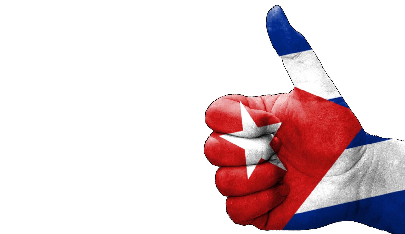 thumbs up in approval with the Cuban flag painted photo