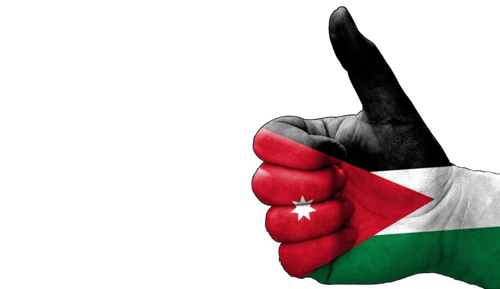 thumbs up in approval with the Jordanian flag painted, photo
