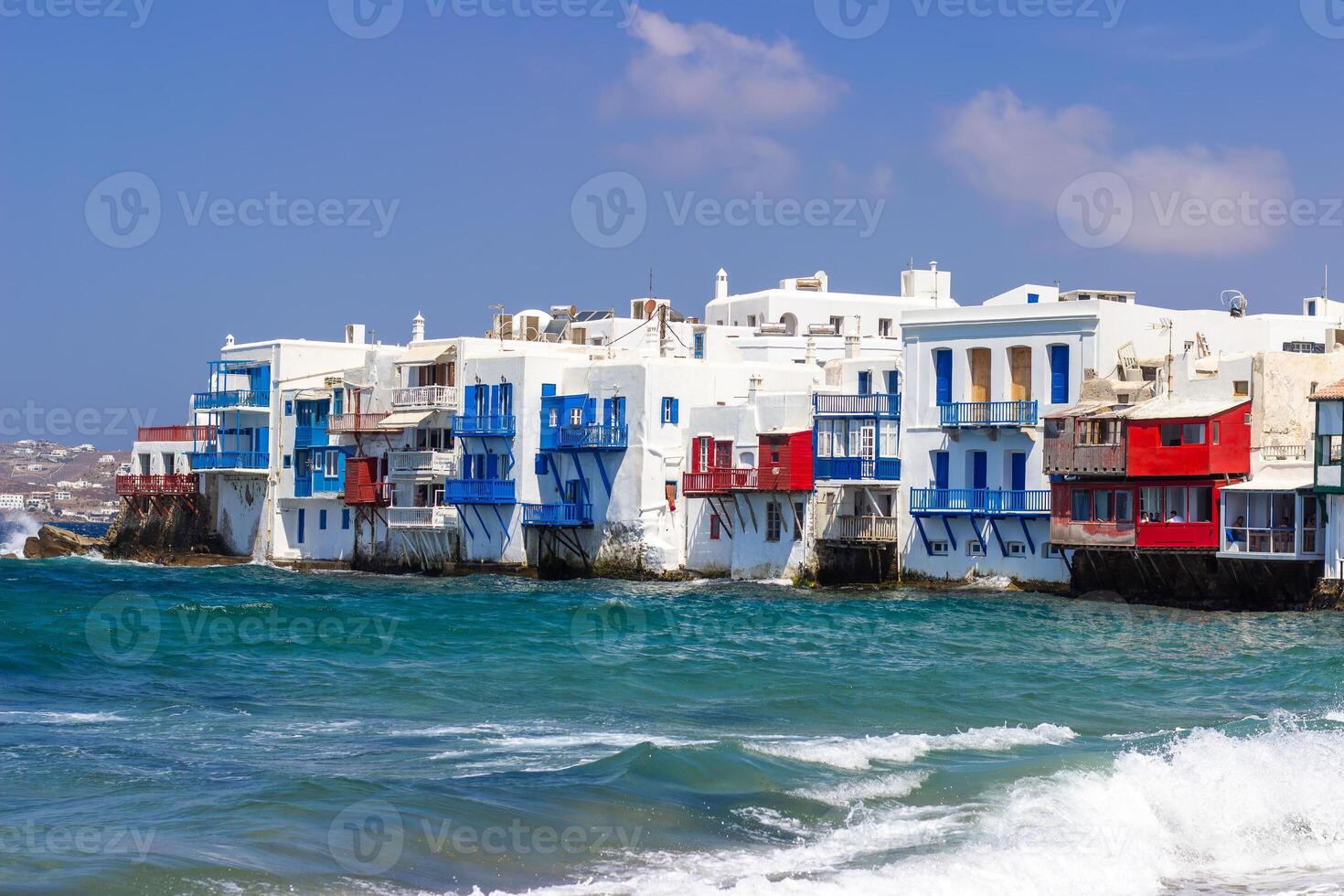 View of traditional greek village with white houses on Mykonos Island, Greece photo