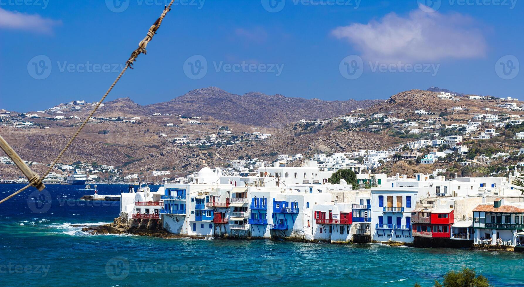 View of traditional greek village with white houses on Mykonos Island, Greece photo