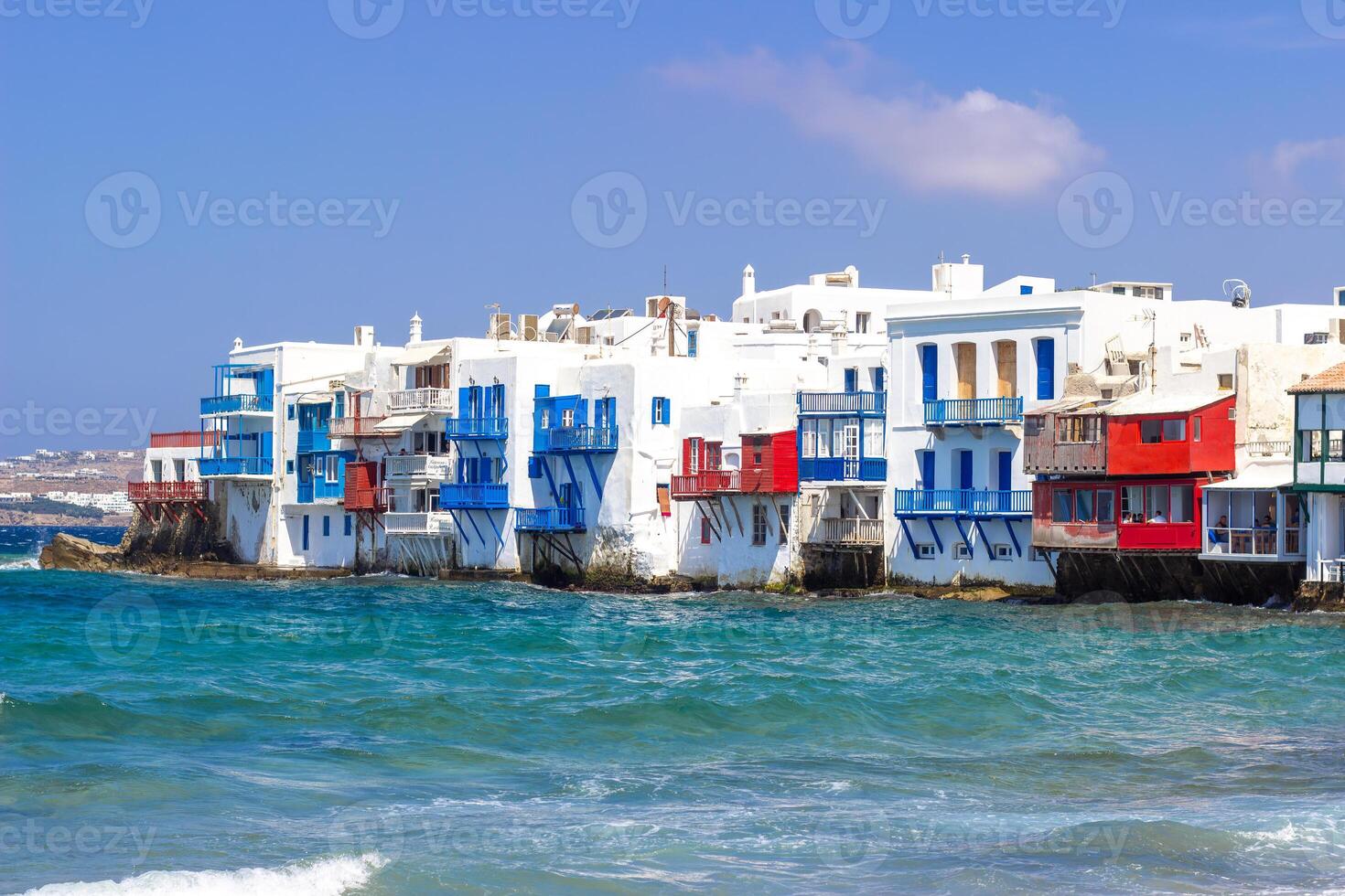 View of traditional greek village with white houses on Mykonos Island, Greece photo