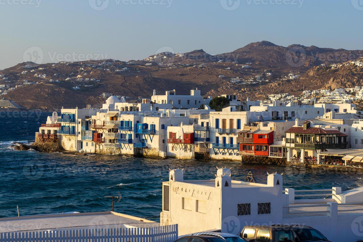 View of traditional greek village with white houses on Mykonos Island, Greece photo