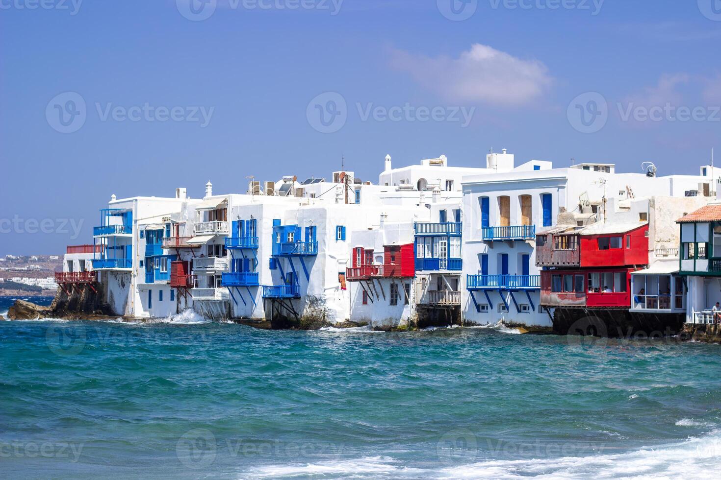 View of traditional greek village with white houses on Mykonos Island, Greece photo