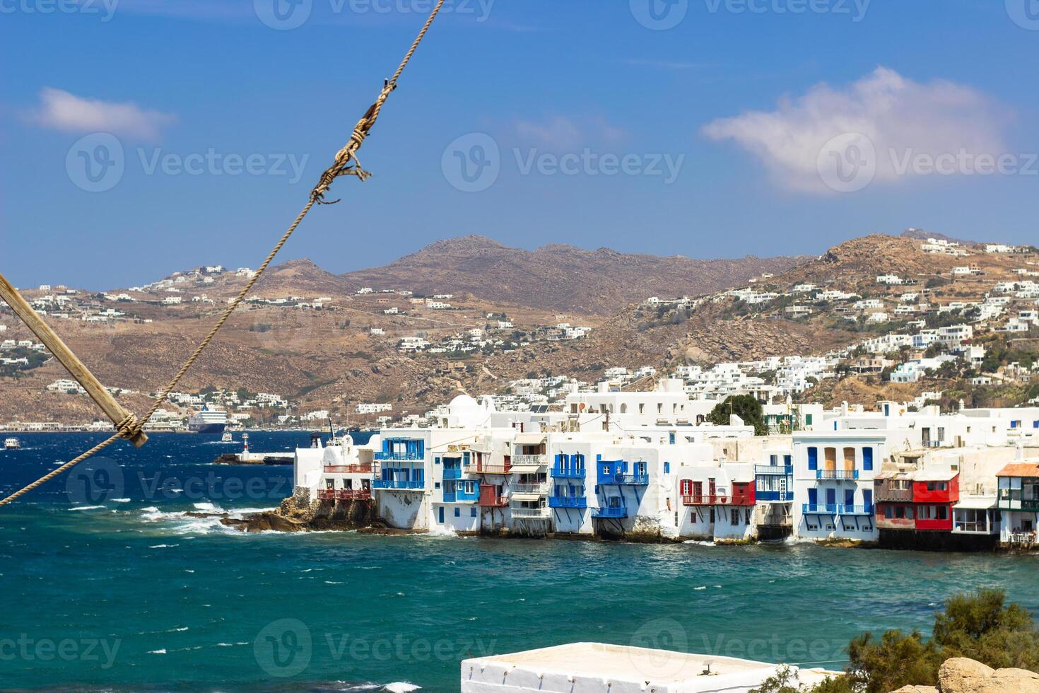 View of traditional greek village with white houses on Mykonos Island, Greece photo