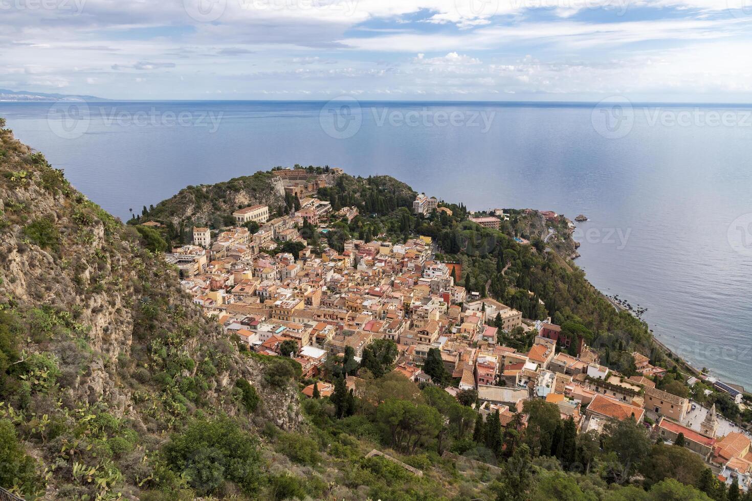 Hills with ancient Greek theater of Taormina city, Sicily, Italy, from Castelmola photo