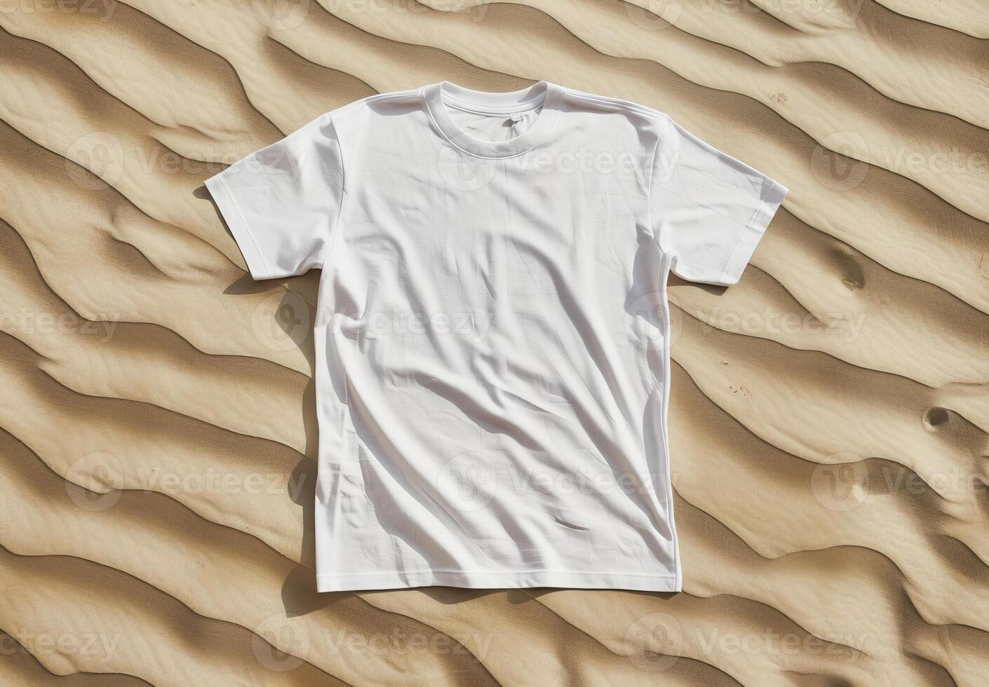 White t-shirt on sand texture. Cotton tshirt in nature coastline background. Mockup blank fashion desert design. Casual blank shirt textile. Empty mock up cloth collection photo