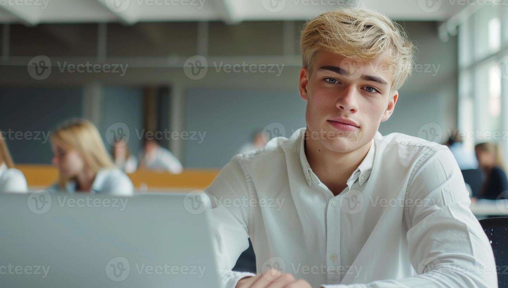 Man in school. Boy studying in highschool class. Male teenager in college. Lecture in university. Concept of knowledge or education. Blond young student at classroom photo