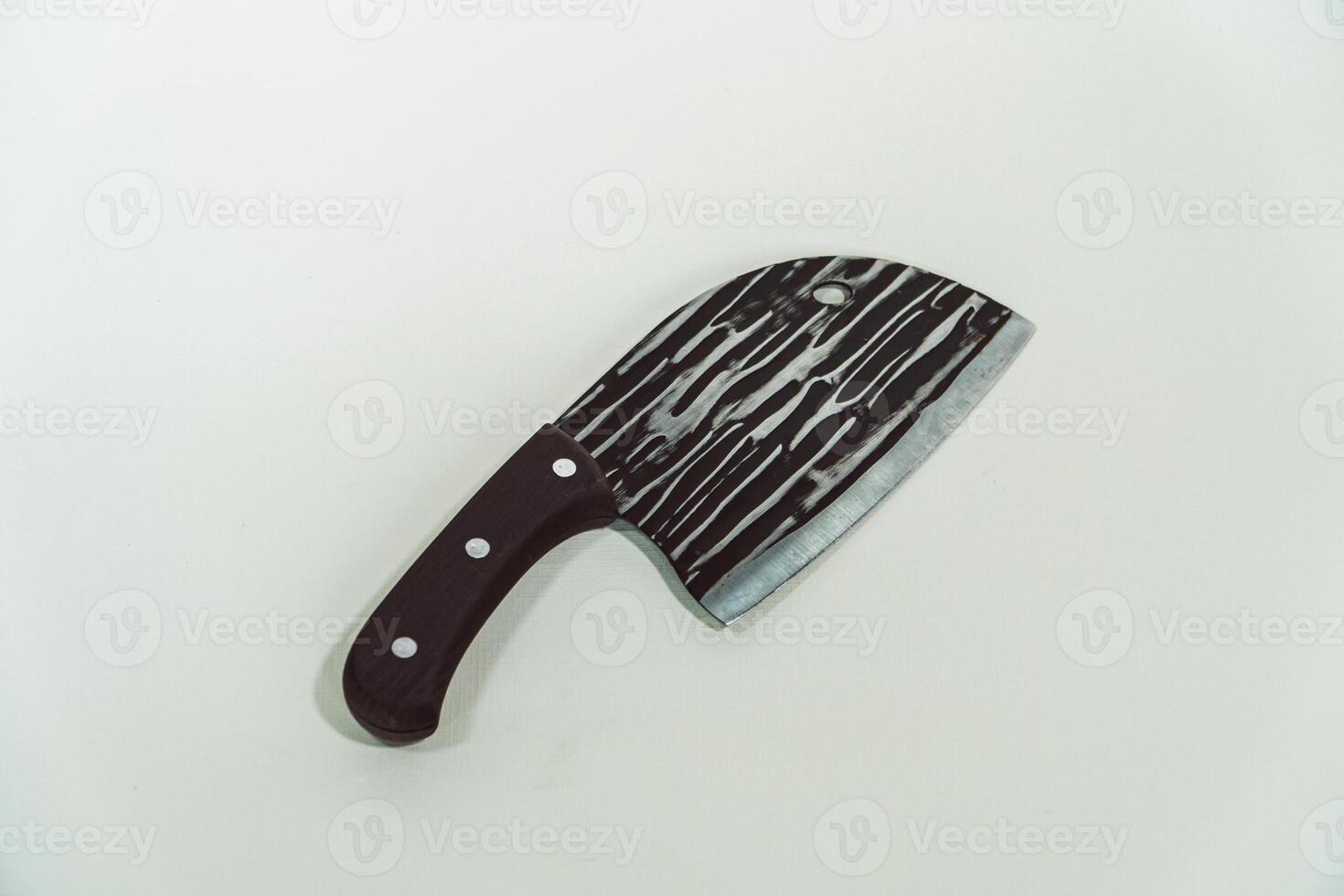 Close up of an adventure and bushcraft knife using a wooden handle. Knife with a sharp stainless steel blade with a wooden handle, perfect for outdoor adventures and bushcraft activities photo