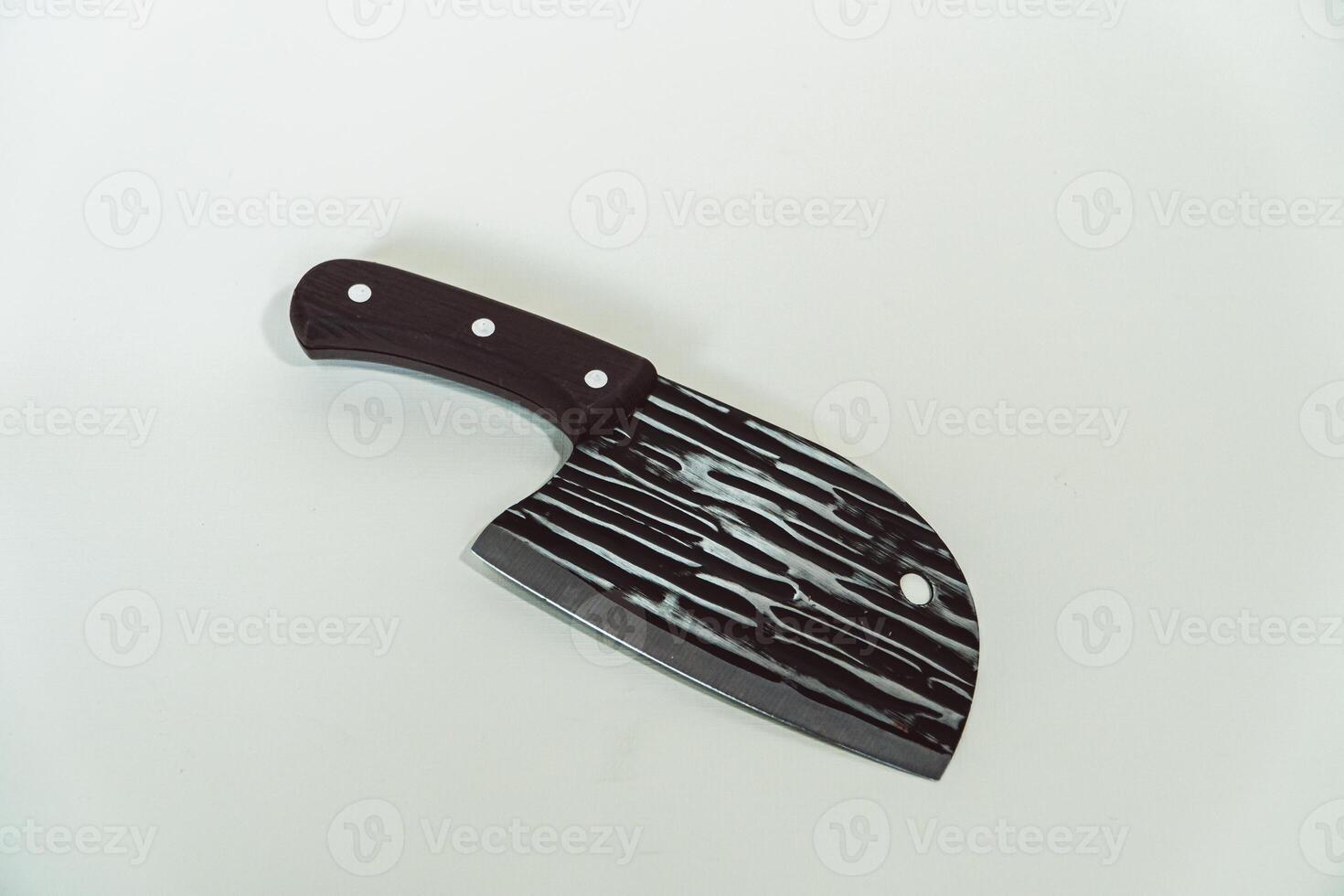Close up of an adventure and bushcraft knife using a wooden handle. Knife with a sharp stainless steel blade with a wooden handle, perfect for outdoor adventures and bushcraft activities photo