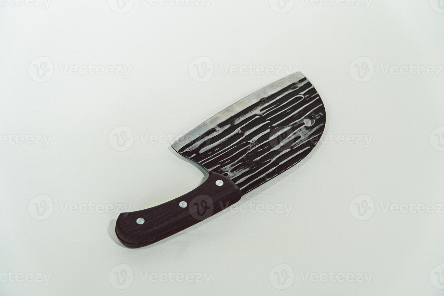 Close up of an adventure and bushcraft knife using a wooden handle. Knife with a sharp stainless steel blade with a wooden handle, perfect for outdoor adventures and bushcraft activities photo