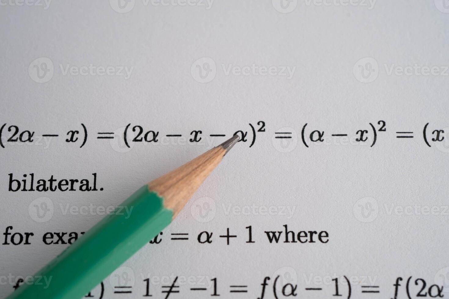 Pencil on mathematic formula exercise test paper in education school. photo